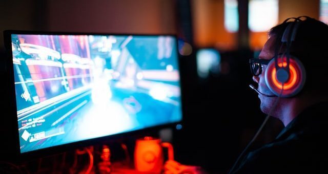 person playing video game on PC