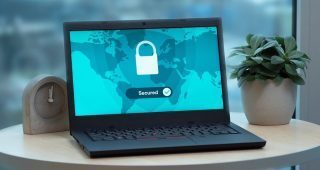 VPN software running on a laptop resting on a desk