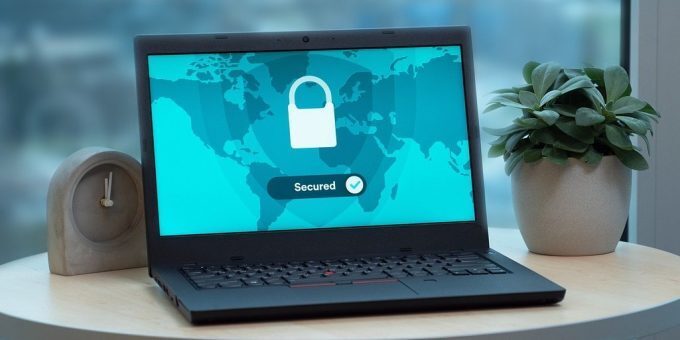 VPN software running on a laptop resting on a desk